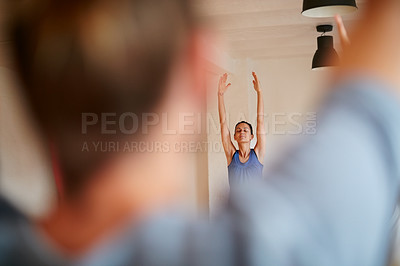 Buy stock photo Cropped shot of people practising yoga in a studio