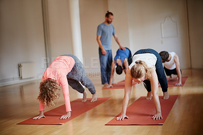 Buy stock photo Shot of a group of people attending a yoga class