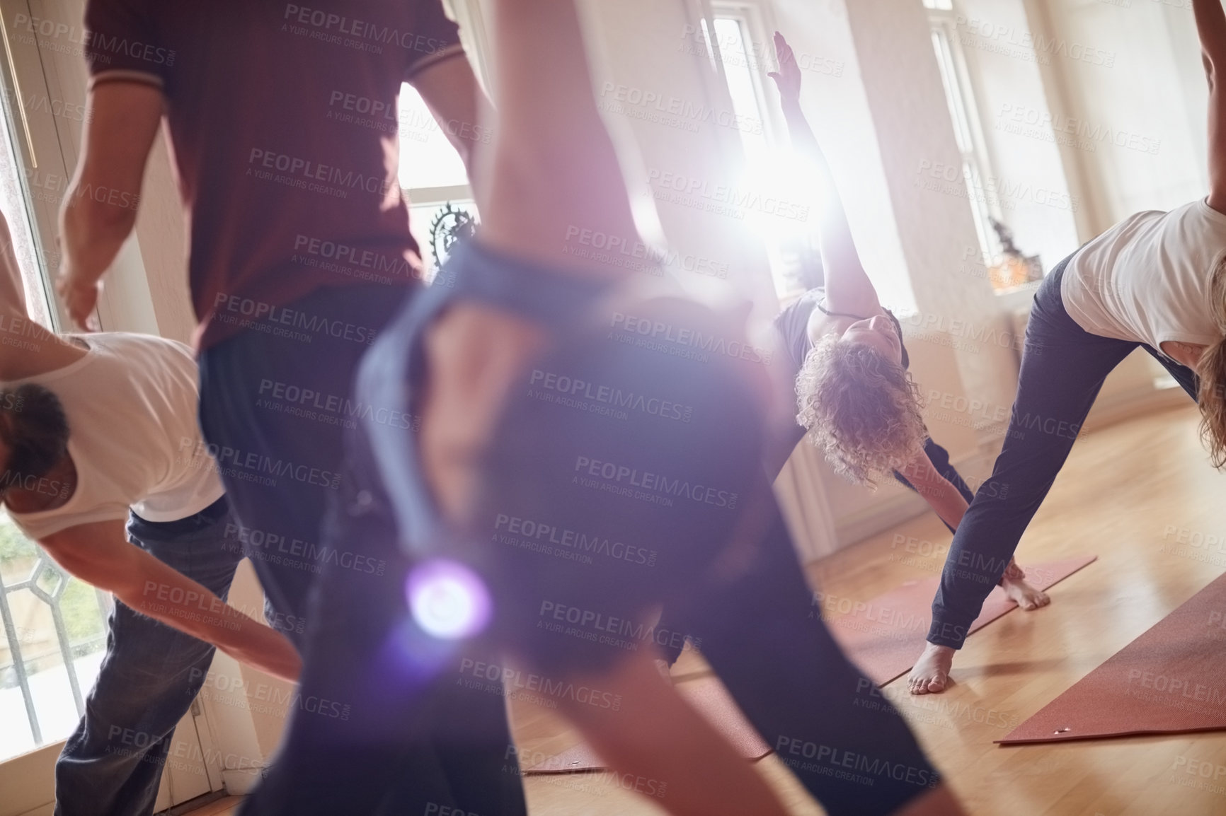 Buy stock photo Cropped shot of a group of people attending a yoga class