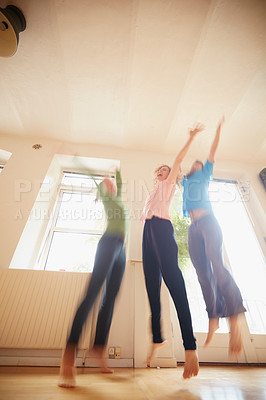 Buy stock photo Shot of a group of yoga enthusiasts standing together in a studio
