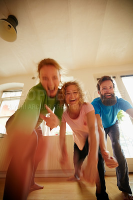 Buy stock photo Shot of a group of yoga enthusiasts standing together in a studio