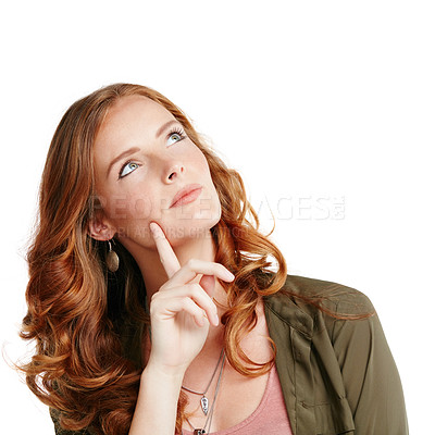 Buy stock photo Studio shot of a young woman looking thoughtful against a white background