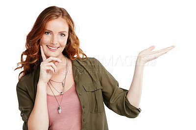 Buy stock photo Shot of an attractive young woman presenting copyspace against a white background