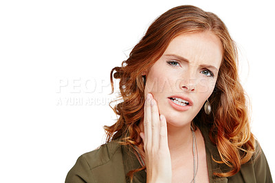 Buy stock photo Studio shot of a young woman experiencing toothache against a white background