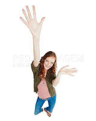Buy stock photo Shot of a young woman with her arm raised against a white background