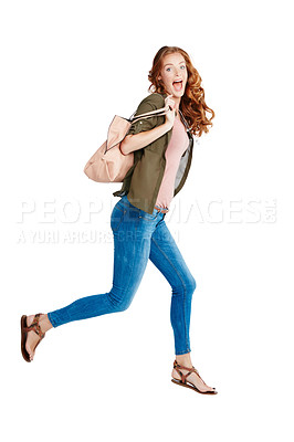 Buy stock photo Studio shot of a young woman running against a white background