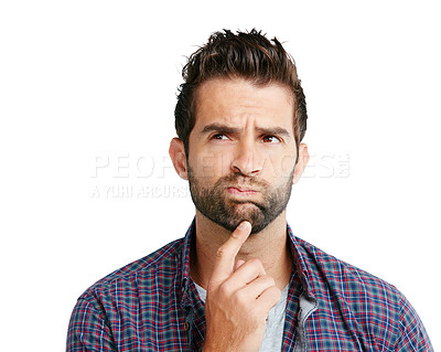 Buy stock photo Shot of a young man looking unsure against a white background