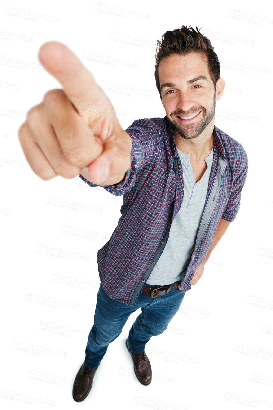Buy stock photo Studio shot of a young man pointing against a white background