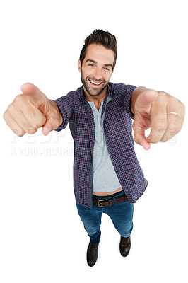 Buy stock photo Studio shot of a young man pointing against a white background