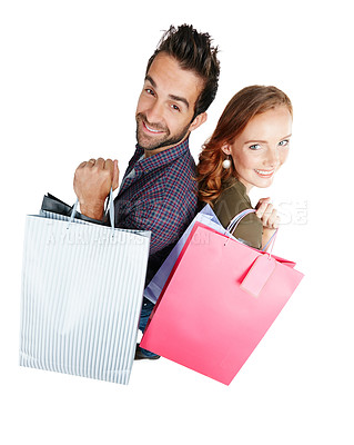 Buy stock photo Shot of a couple holding shopping bags against a white background