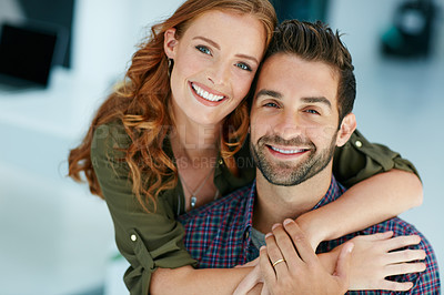 Buy stock photo Portrait of an affectionate young couple embracing each other