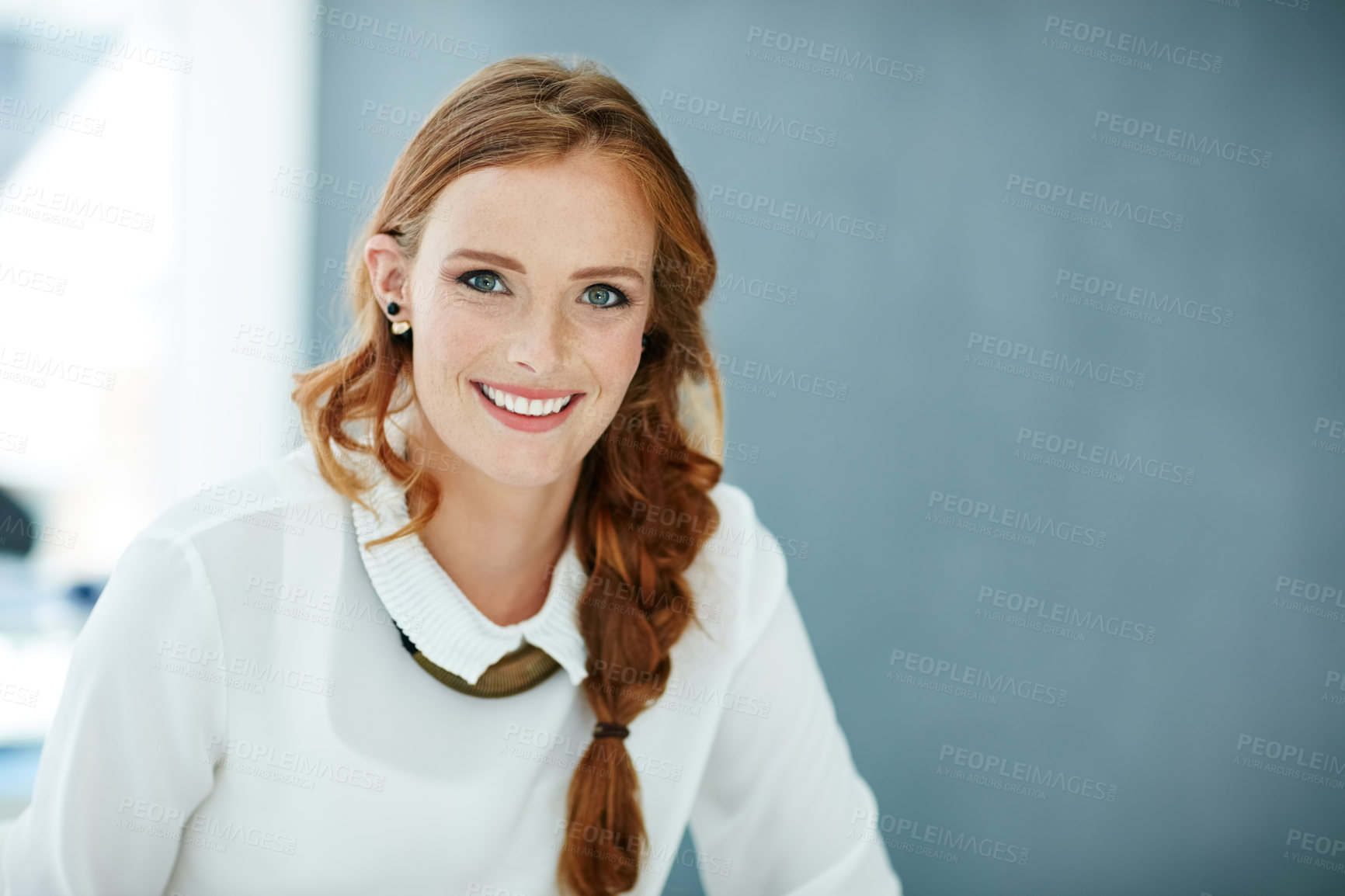 Buy stock photo Portrait of a young businesswoman sitting in an office