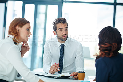 Buy stock photo Cropped shot of businesspeople having a discussion in an office