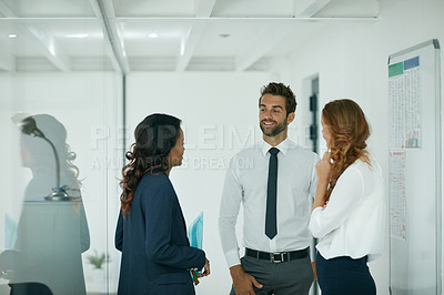 Buy stock photo Cropped shot of colleagues having a discussion in an office