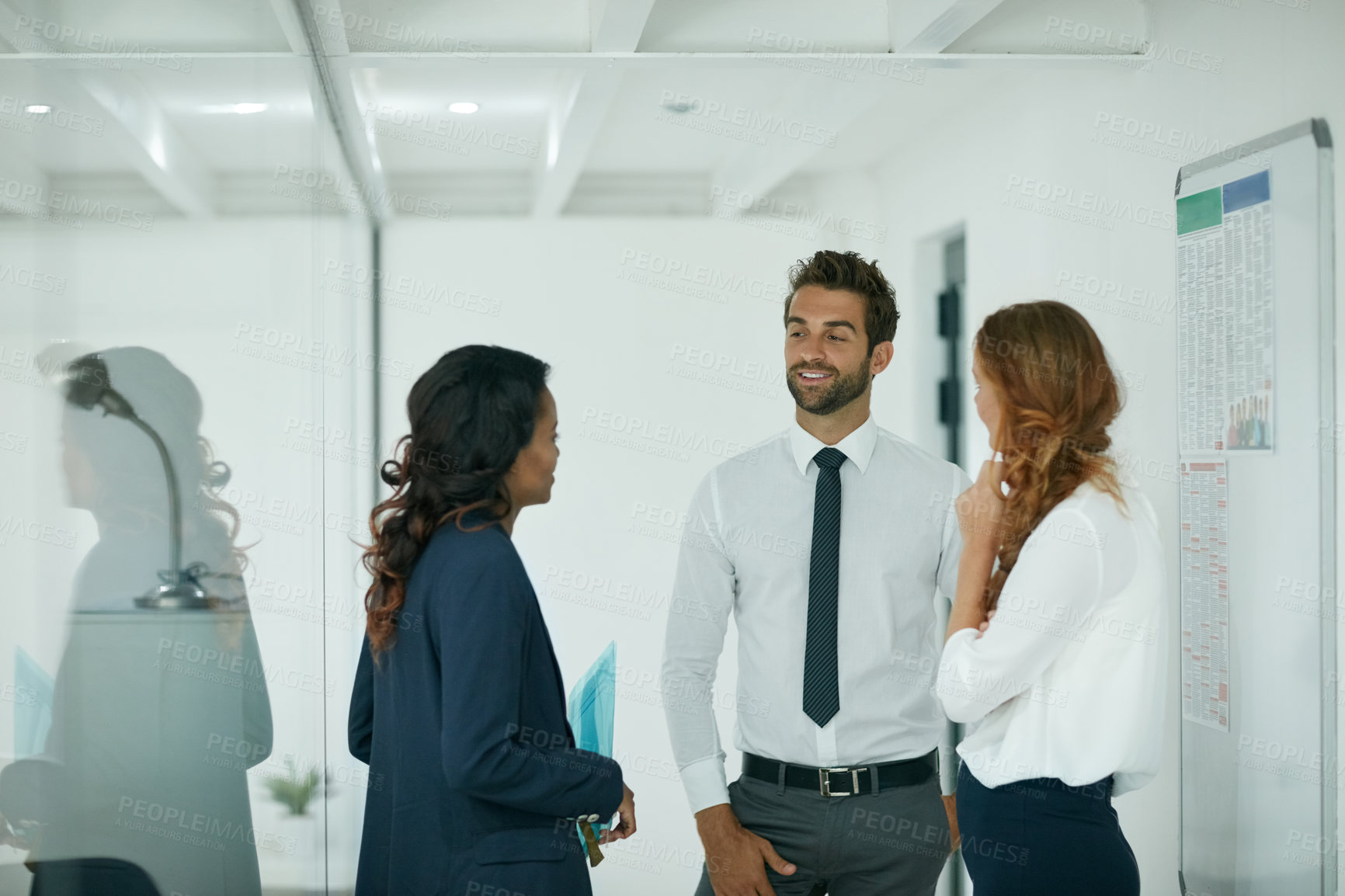 Buy stock photo Cropped shot of colleagues having a discussion in an office