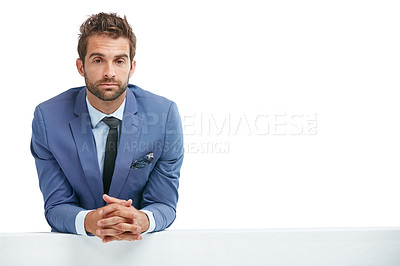 Buy stock photo Studio shot of a handsome businessman leaning against a wall isolated on white