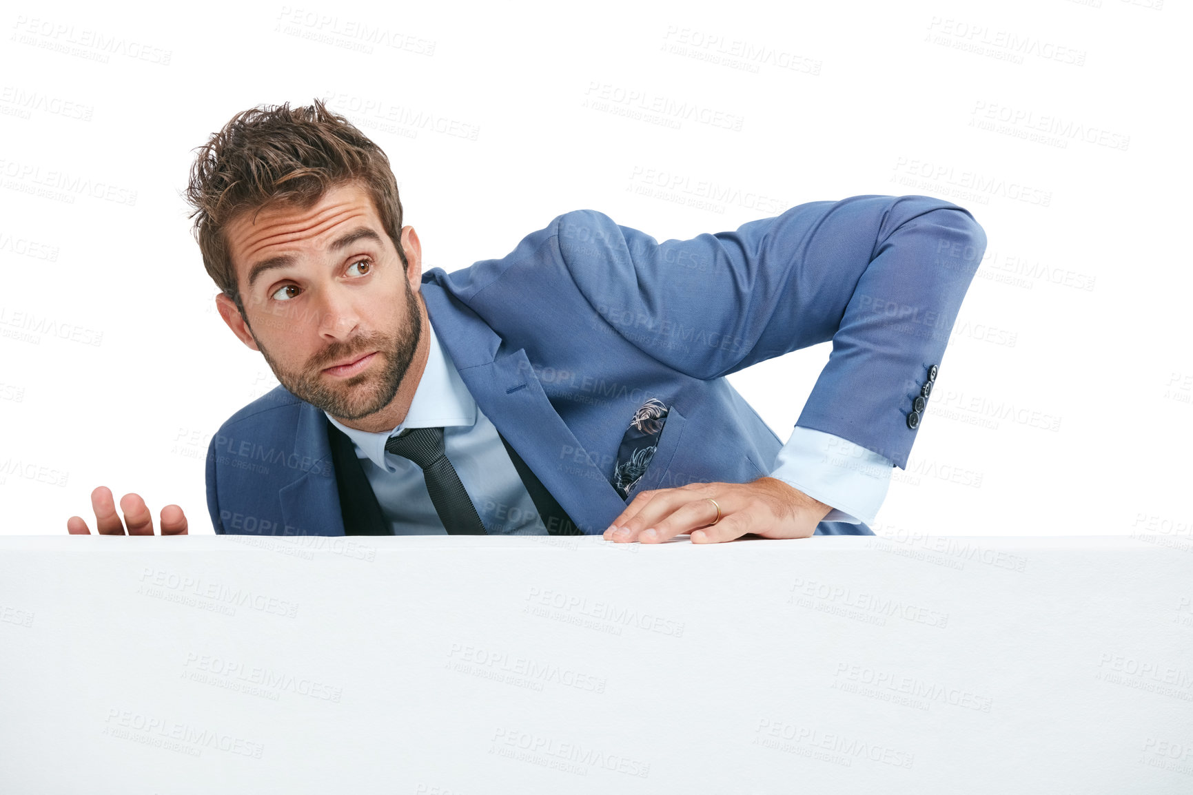 Buy stock photo Studio shot of a handsome businessman looking scared while climbing a wall against a white background