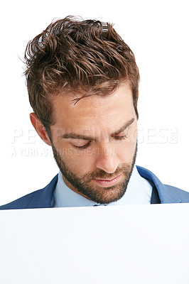 Buy stock photo Studio shot of a handsome man holding up a blank placard against a white background