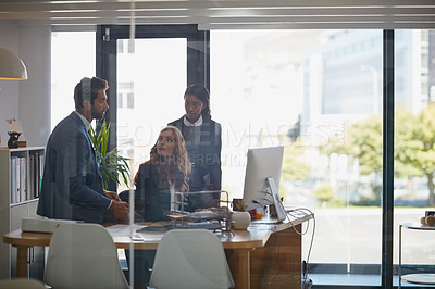 Buy stock photo Cropped shot of colleagues working together on a computer in an office