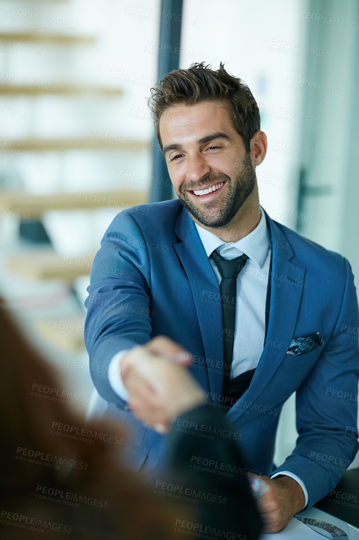 Buy stock photo Cropped shot of businesspeople shaking hands in an office