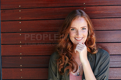 Buy stock photo Portrait of an attractive young woman posing against a wooden wall