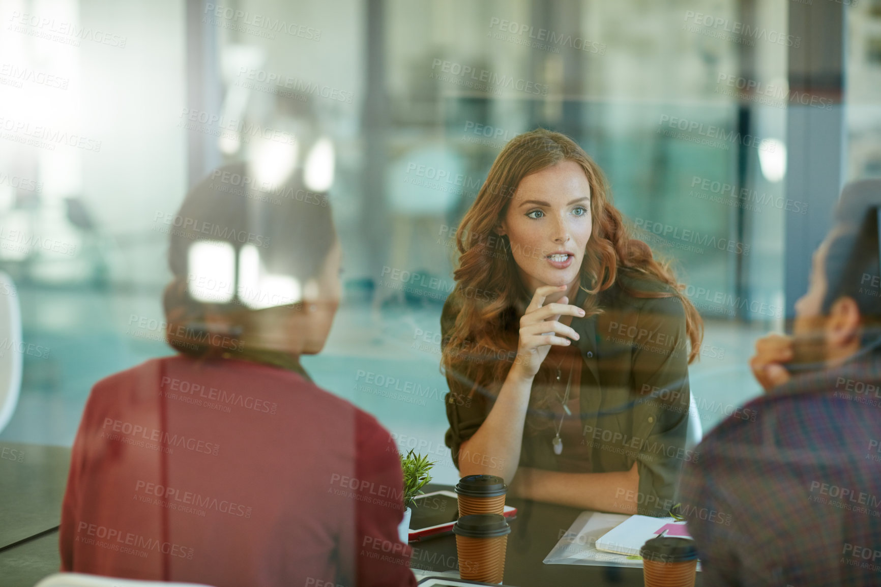 Buy stock photo Shot of a team of creative businesspeople having a meeting in their office