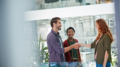 Buy stock photo Shot of a team of creative businesspeople meeting a new teammember in the office