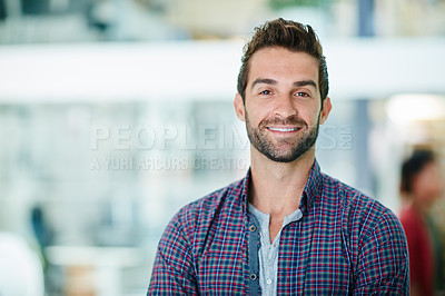 Buy stock photo Portrait of a happy young businessman standing in his office