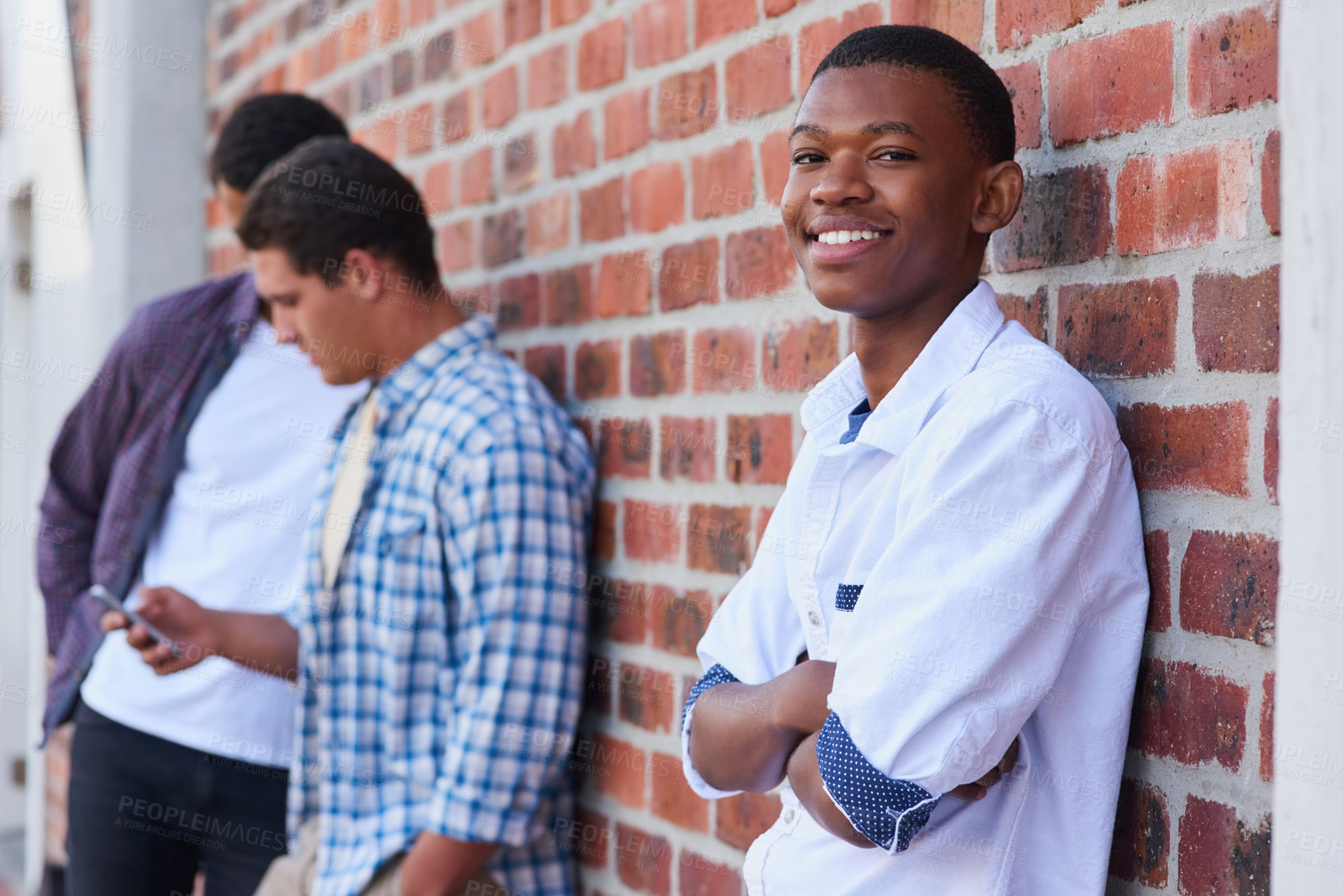 Buy stock photo Portrait of a university student on campus with his friends in the background