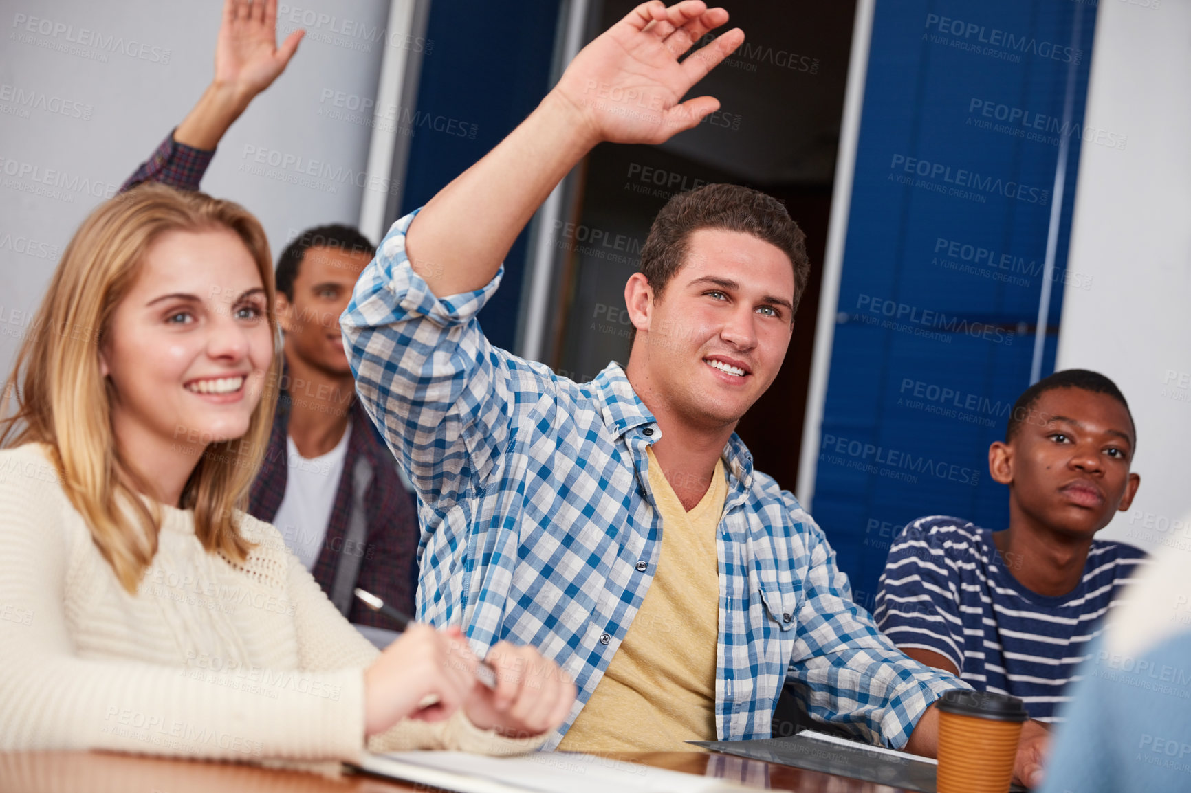 Buy stock photo Cropped shot of a group of university students sitting in class