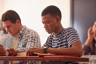 Buy stock photo Cropped shot of a group of university students sitting in class