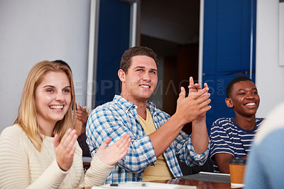 Buy stock photo Cropped shot of a group of university students applauding together in class