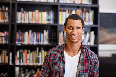 Buy stock photo Portrait of a university student standing in the campus library