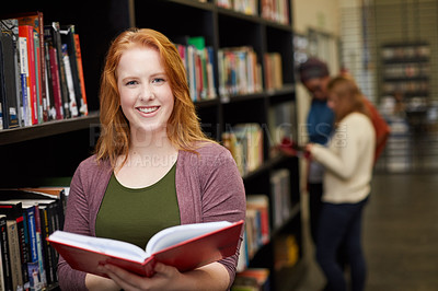 Buy stock photo Portrait of a university student working in the campus library