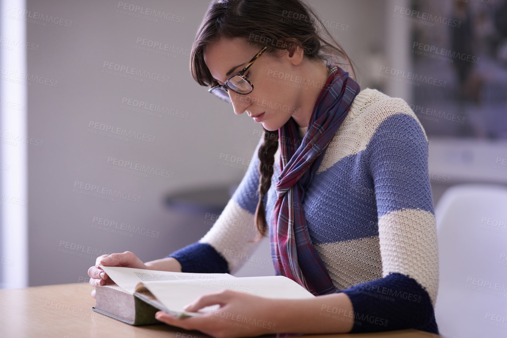 Buy stock photo Shot of a young university student studying in her classroom