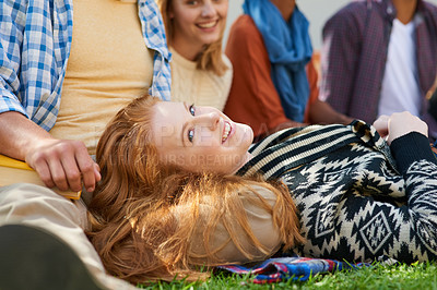 Buy stock photo Portrait of a student relaxing outside with her friends