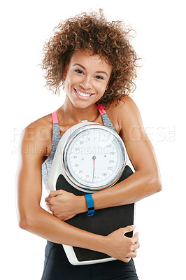 Buy stock photo Studio shot of a fit young woman embracing a scale against a white background