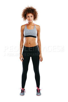 Buy stock photo Studio portrait of a fit young woman posing against a white background