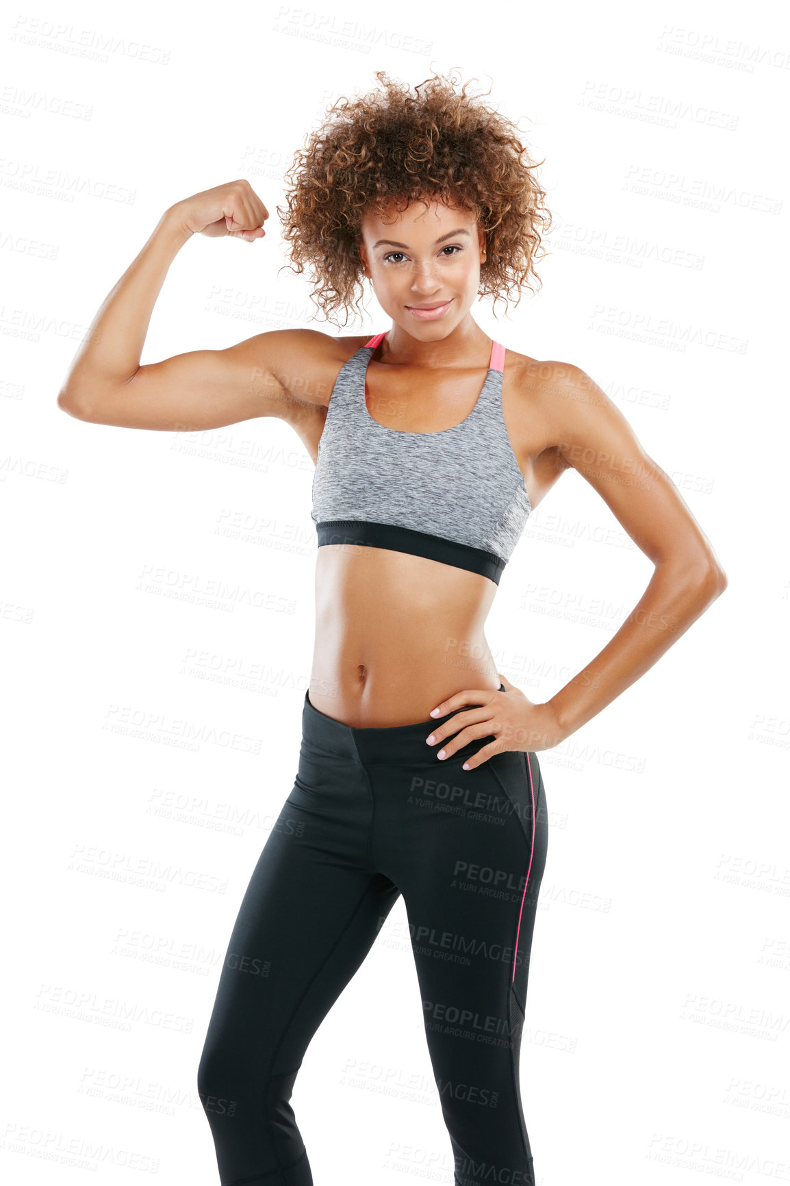 Buy stock photo Studio shot of a fit young woman flexing her muscles against a white background