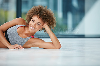 Buy stock photo Shot of a young woman looking relaxed after her workout