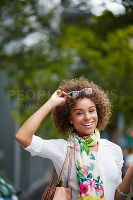 Buy stock photo Portrait of an attractive young woman enjoying her day in the city