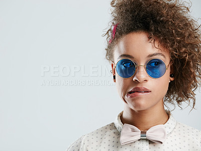 Buy stock photo Thinking, sunglasses and a black woman biting her lip in studio on a gray background for marketing. Idea, doubt and fashion with a female model posing to promote a brand of frame on mockup space