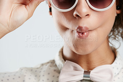 Buy stock photo Sunglasses, fashion and face of woman with kiss pose on white background for summer, casual and trendy style. Creative, beauty and zoom of girl isolated in studio for cosmetics, makeup and confidence