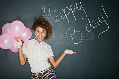 Buy stock photo Excited, happy birthday balloons and portrait of a model and chalkboard for celebration. Happy, smile and excited person with birthday words and party sign to celebrate fun event with style in studio