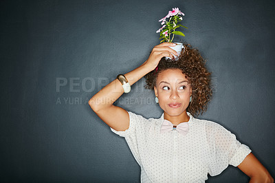 Buy stock photo Flower plant, beauty studio and black woman thinking with natural green flowers, agriculture plant or nature product. Marketing, mockup or eco friendly fashion model isolated on chalkboard background