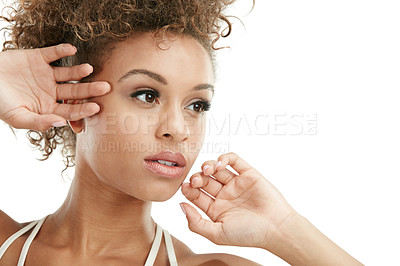 Buy stock photo Studio shot of a beautiful young woman posing against a white background