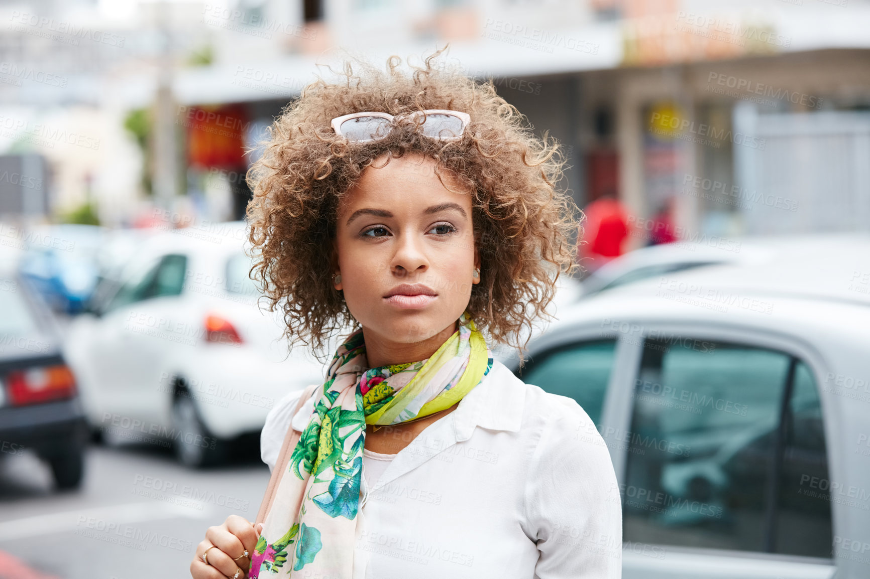 Buy stock photo Shot of an attractive young woman exploring the city on her day off