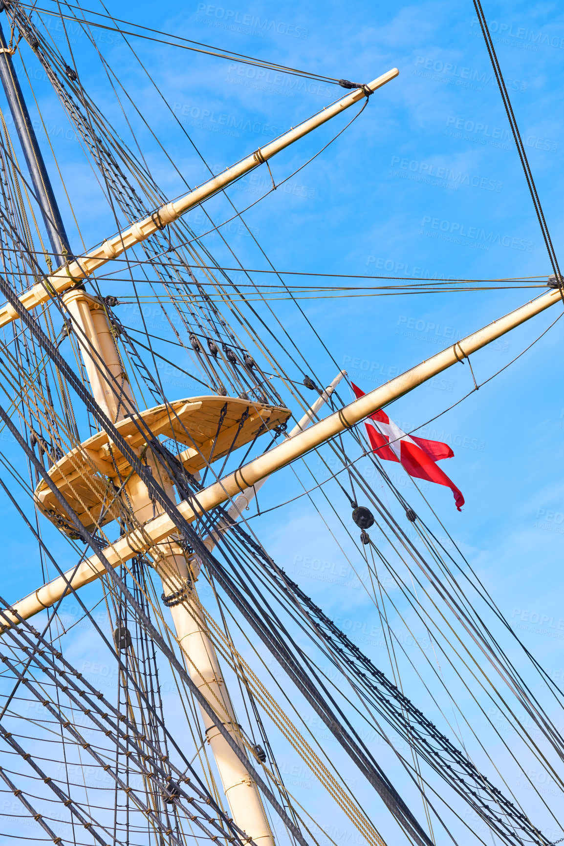 Buy stock photo Blue sky, flag and travel with mast of ship outdoor in nature from below for Danish heritage. Adventure, history and rope with banner on wooden sail boat for journey, holiday or vacation at sea