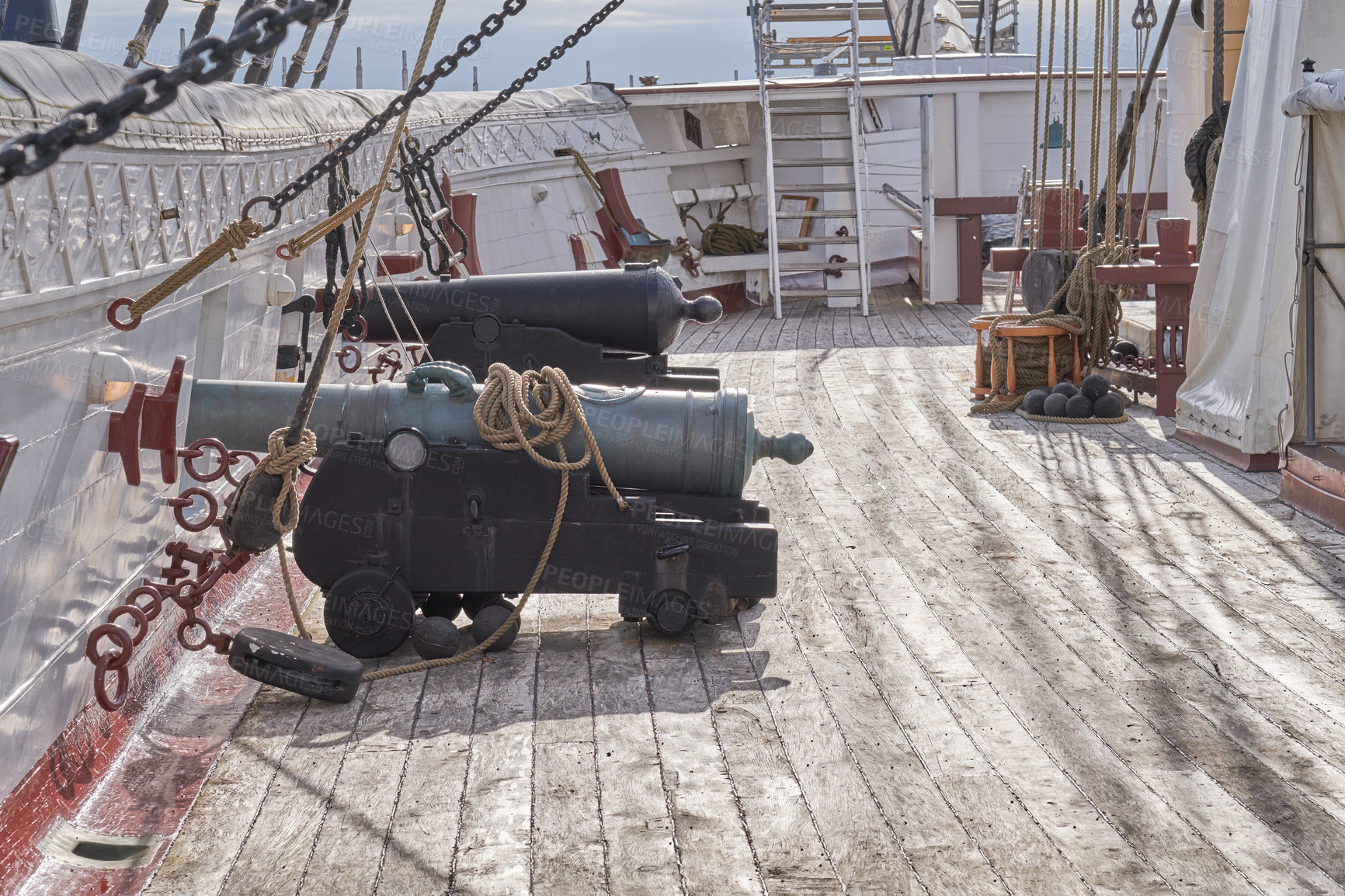 Buy stock photo Museum, boat or cannon on deck in vessel for sightseeing, tourist attraction or national treasure in Denmark. History, architecture or ship with war weapon for landmark, ocean transport or exhibition