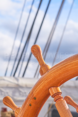 Buy stock photo Wood, ship and vintage steering wheel closeup for sailing, travel and navigation or control direction. Boat, helm and old transport for cruise, history and voyage for journey on deck for vacation